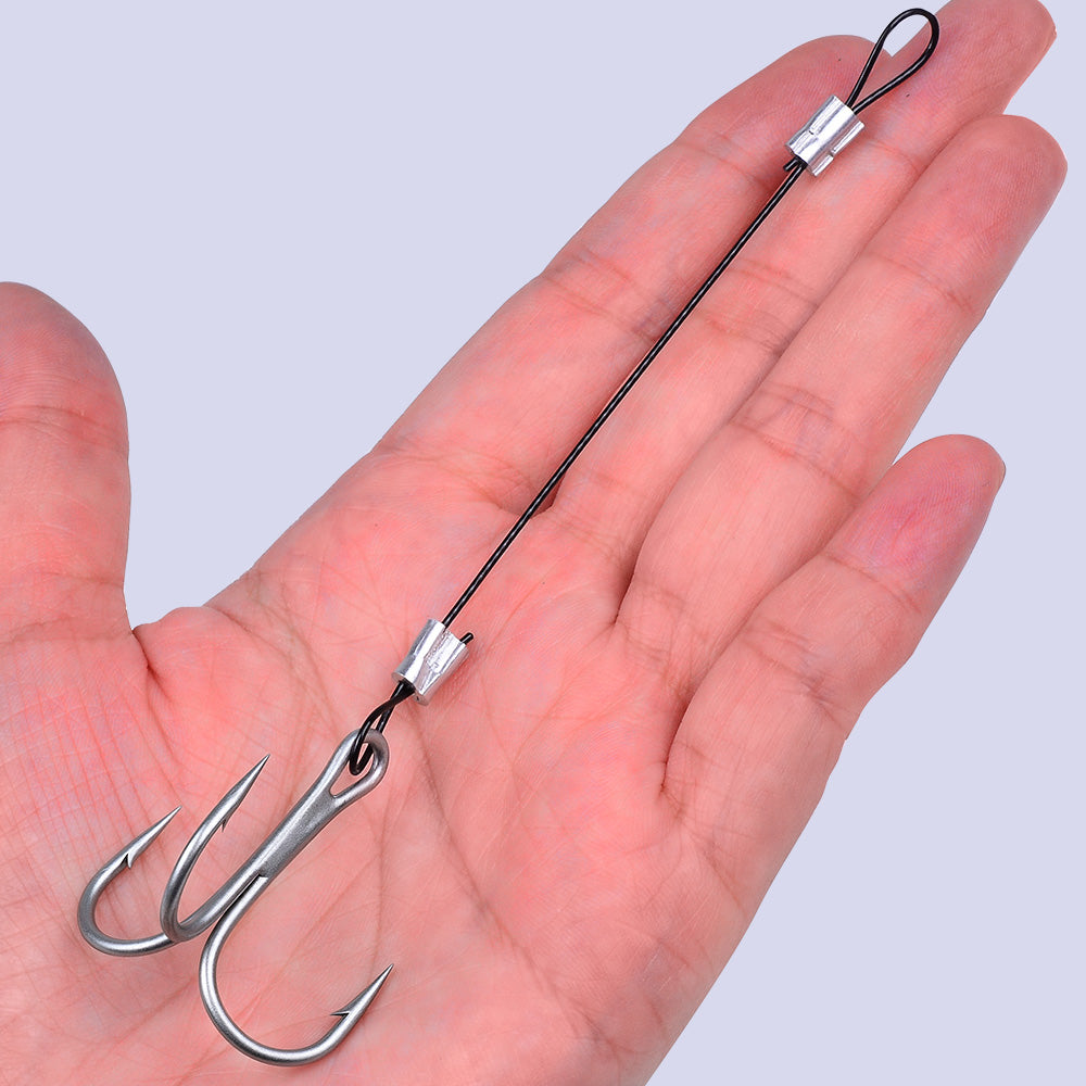 Close-up of Proberos PJ038 pre-tied wire leader rig showing ultra-sharp blood groove barbed treble hook and crimped stainless steel wire trace