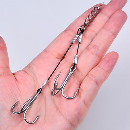 Hand holding PROBEROS PJ037 double treble stinger rig showing high strength wire