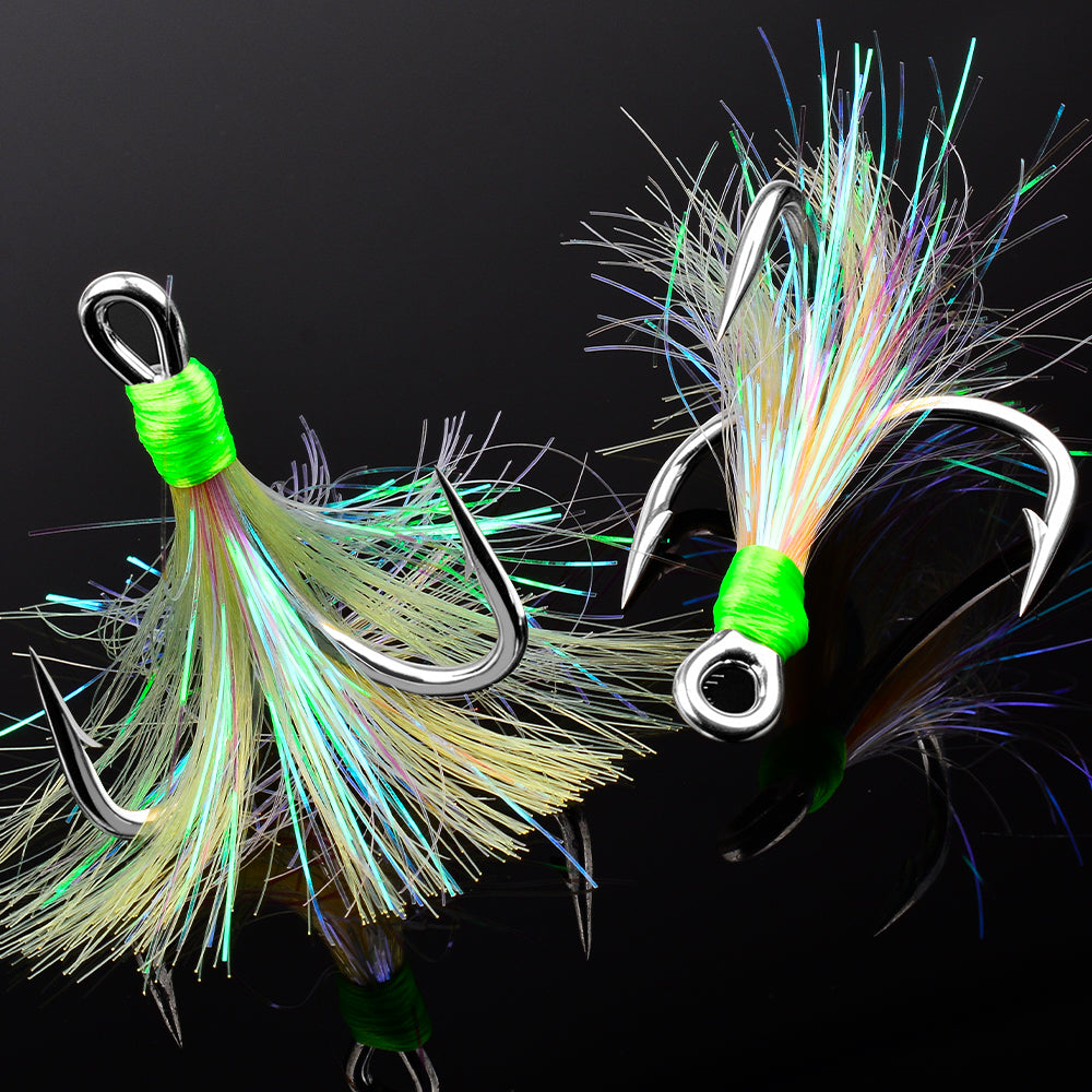 Close-up of PROBEROS SZ126 silver treble hook with white flash feather tail and barbed point